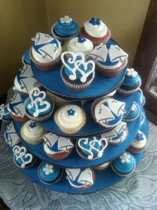 Interlocking Hearts, Wedding Bells, and Navy Blue Flowers on a tiered Cupcake Tree provided by Bear Heart Baking Company